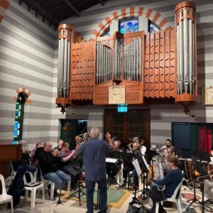 Conductor Les Sivwright takes the Band through their paces